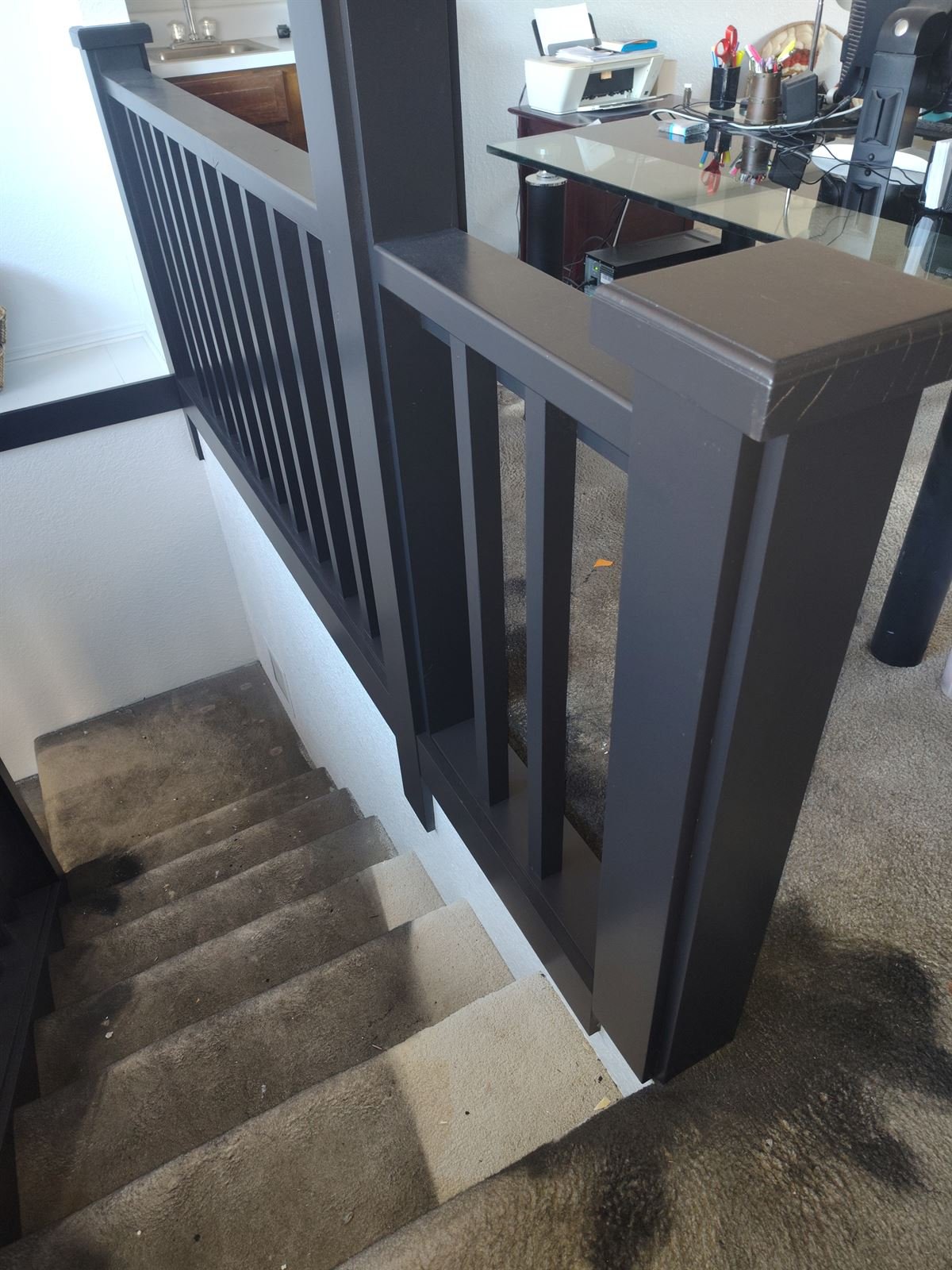Stair railing repainted in modern matte black